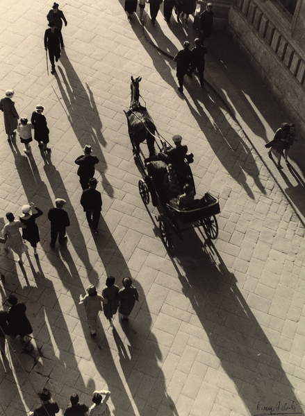 street of Florence in 1938, view from above of a carriage with horse and people walking around, black and white photo