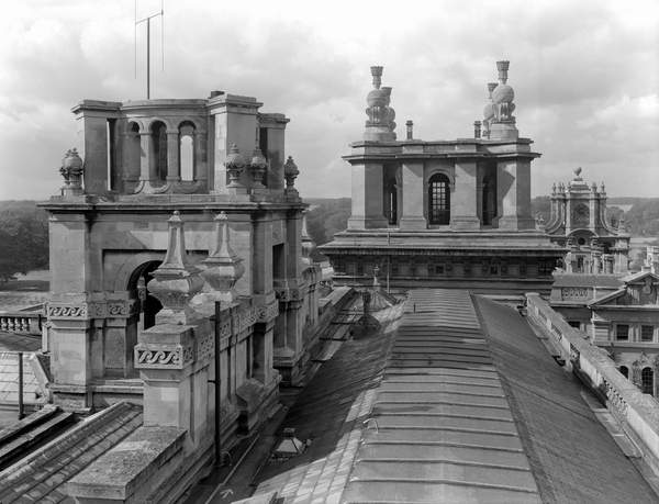Roofscape at Blenheim Palace, showing the north-east tower in the centre and the profile of the east gate tower in the right distance; from 'The Country Houses of Sir John Vanbrugh' by Jeremy Musson, published 2008 (b/w photo), English Photographer, (20th century) / © Country Life / Bridgeman Images