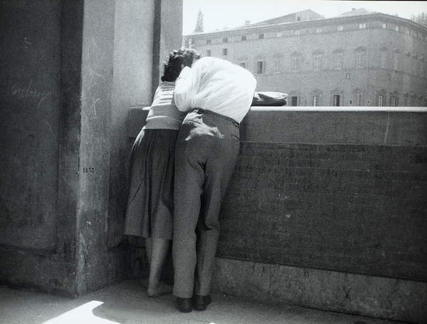 couple in love hugging looking over a balcony in Florence 1954, black and white photo